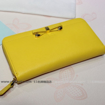 2014年Prada普拉達時尚款 可愛蝴蝶結十字紋原版牛皮皮夾 1M0506黃色